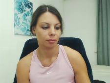 This cam girl demonstrates her cup size B breast part behind the sexcam
