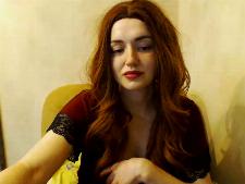 A petite webcam girl with red hair during cams sex