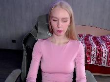 A petite webcambabe with blond hair during webcam sex
