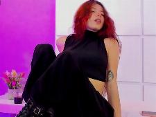 The European cam lady LolaMustaine during one of her webcamsex performances