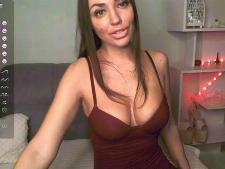 A petite webcam lady with brown hair during cam sex